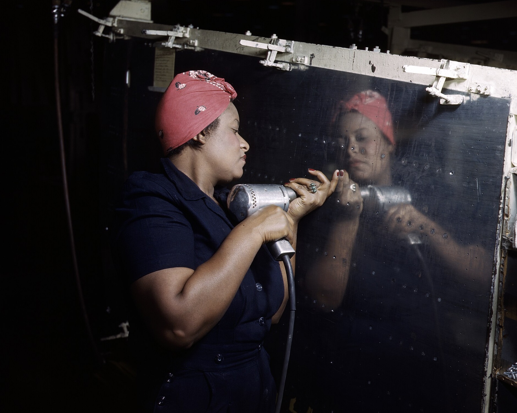 "Rosie the Riveter", working on an A-31 "Vengeance" dive bomber 